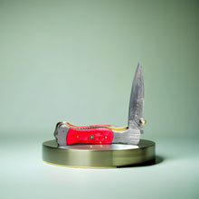 Load image into Gallery viewer, Artisan Folding Knife with Damascus Blade and Vibrant Red Handle
