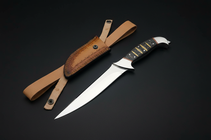 Knife spear-point angled on black background