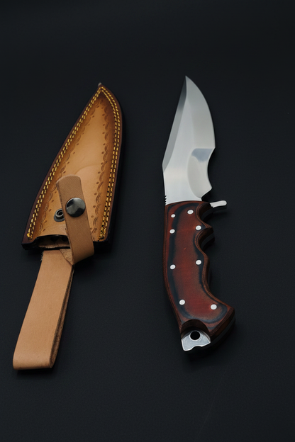 Skinner knife overlapping on black background