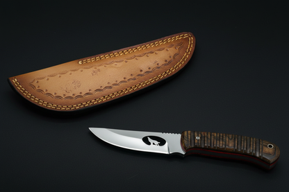 Wolf knife separated from sheath on black